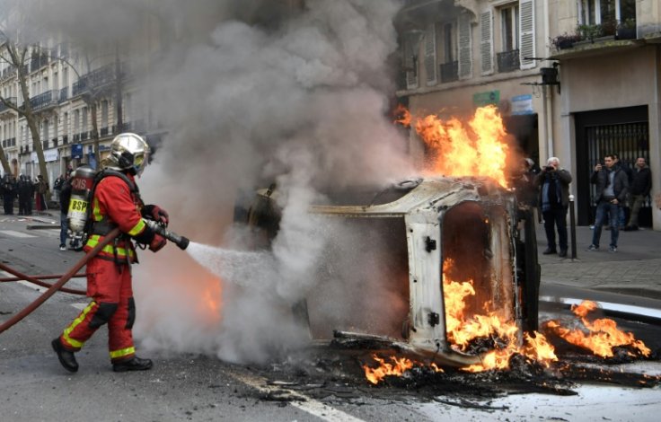 There were tensions when a car and a bin were overturned and set on fire