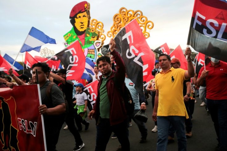 Supporters of Nicaraguan President Daniel Ortega march in Managua on February 11, 2023 after his government released and expelled more than 200 dissidents