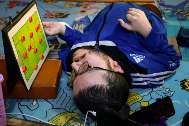 Amer Abu Nawas was born with osteogenesis, or brittle bone disease, a genetic condition hindering normal bone growth that has meant he rarely leaves his home