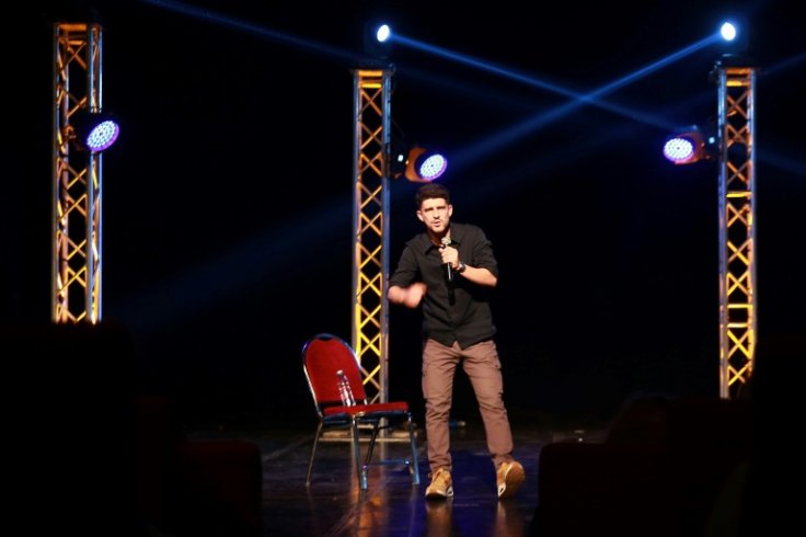 Yusef Bataineh, a graduate of the Amman Comedy Club, performs on stage at Al-Shams theatre