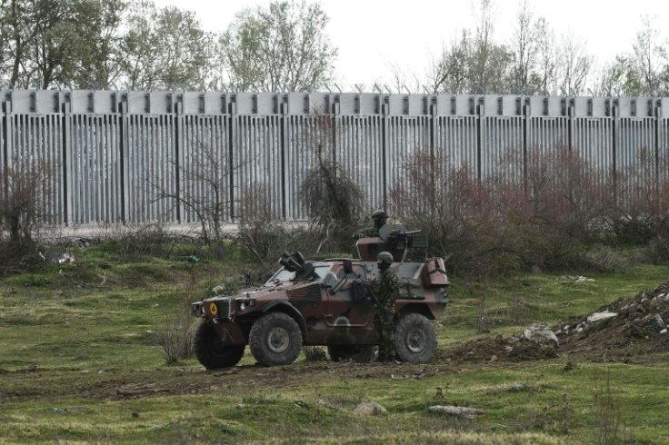 Greek servicemen patrol at the border with Turkey
